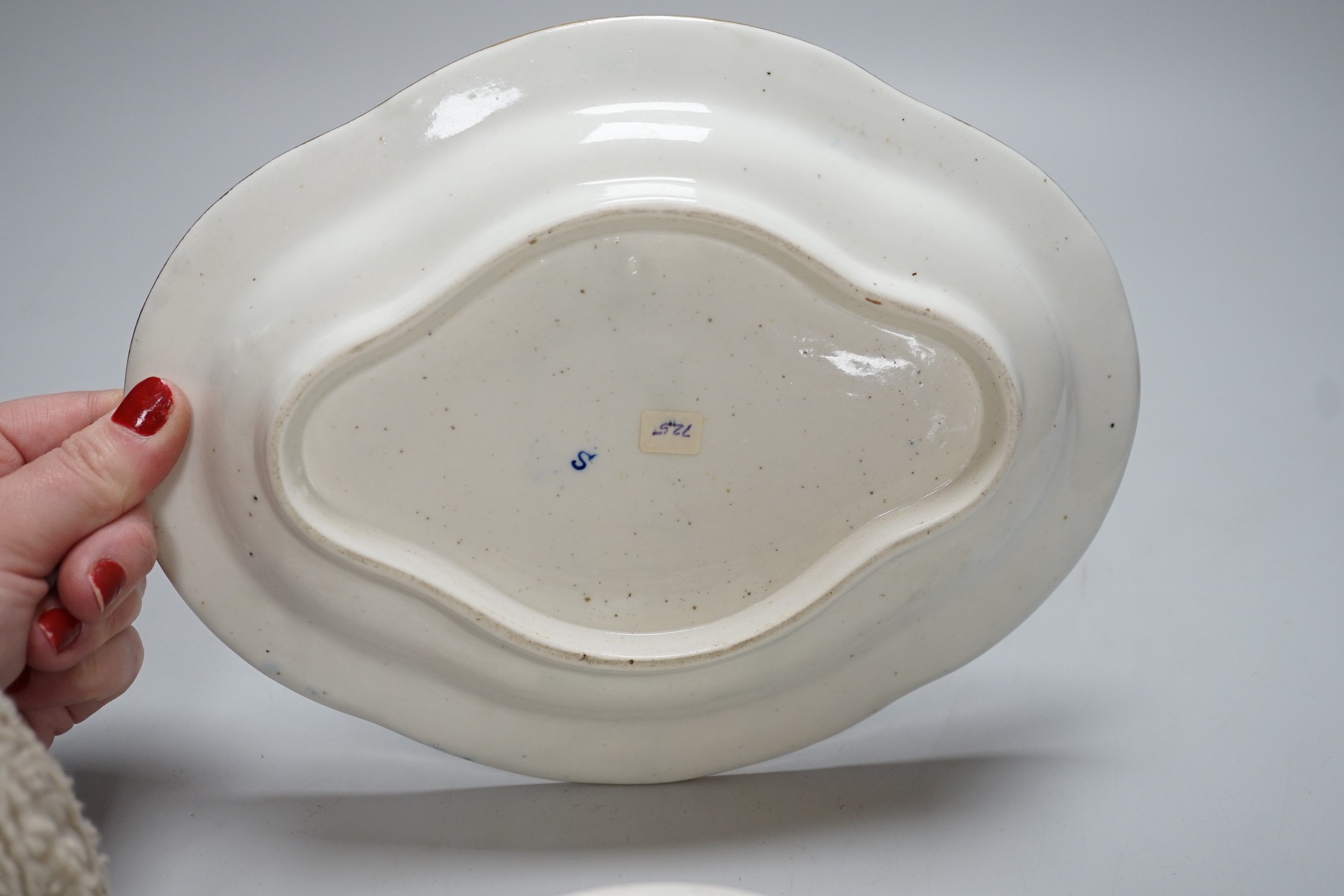 An 18th century Caughley tureen cover and stand with blue and gilt decoration, stand mis-fired to border, S mark to stand and base, stand 23cms wide